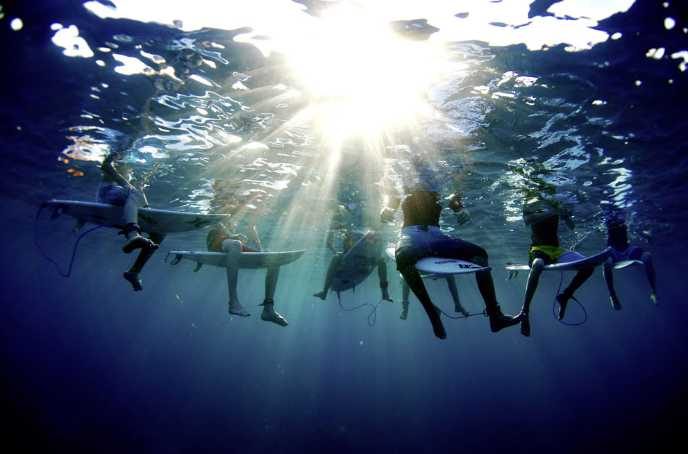 Morgan Maassen won the Lifestyle category for his photo of surfers Jake Marshall, Taylor Clark, Frankie Harrer, Colt Ward, Thelen Whorrell, Nolan Rapoza, and Dryden Brown, in Tavarua, Fiji. "Late one fall I gathered a group of America's next generation of young surfers, and we departed for Fiji to try our hand at an impressive south swell. Arriving at Cloudbreak to perfect conditions and an empty beach, we had an absolute blast enjoying the dreamy scenario. They surfed for ten hours a day, coming in only for food or sunscreen. I captured them one morning in this shot, discussing in the crystalline water anything from the surf they were enjoying to homework they forgot at home. Reflecting on the trip after we had gone our separate ways, it was not the performance of the kids or the caliber of surf that made our adventure memorable; it was their social dynamic. I was fascinated by their camaraderie in the intense surf and realized that while the atmosphere was thick with competition, their friendship had them trading waves with nothing but smiles, laughing and hollering at each other's successes and misfortune with pure glee." (© Morgan Maassen/Red Bull Illume)