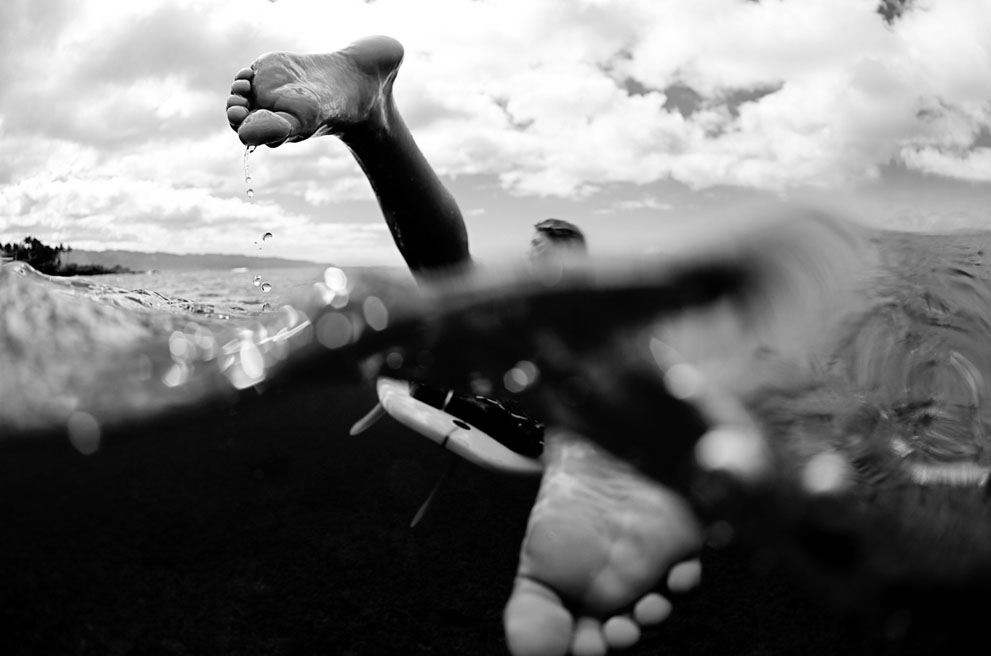 Morgan Maassen, finalist in the Close Up category: "On this overcast day in late autumn, Rebecca Ronald and I went out to Chun's Reef in Hawaii for a surf as the waves were quite clean and uncrowded. Despite the overcast skies, the water was unusually clear so I figured I would shoot with a fisheye, hoping the sun would pop out at some point during our session. Unfortunately, the sun never did come out, but Bec had a marathon session and we lined up on too many waves to count. After riding a wave past where I was shooting, she paddled back towards me... only to swing around and catch another wave. And it was at this moment that I captured this over/under shot of her, showcasing her as she prepares to nab another wave on that delightful day at Chun's Reef." (© Morgan Maassen/Red Bull Illume)